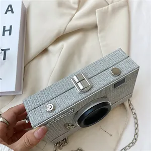 Elegant silver glitter camera-shaped box clutch bag with metallic chain strap detail