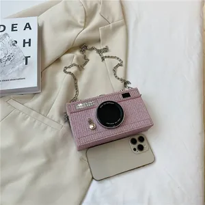 Creative pink camera shaped crossbody box bag with metal chain strap and phone detail