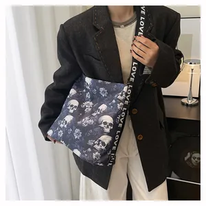 Detailed view of the retro skull and floral print tote bag with a branded LOVE strap