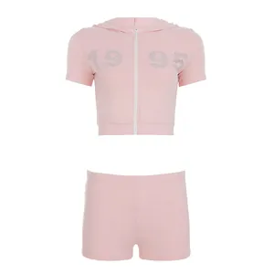 Detailed view of the pink two-piece streetwear set with rhinestone 1995 hoodie and shorts.