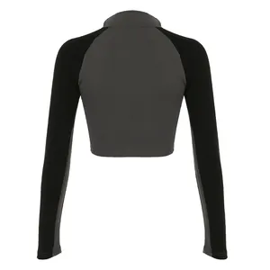 Back view of women's street style color-block long-sleeved crop top in grey and black
