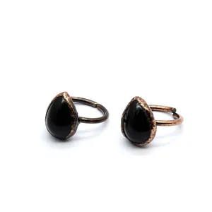 Vintage adjustable open ring with teardrop black stone and antique copper finish.