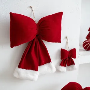 Large plush red Christmas bow wall hanging with white faux fur trim decoration for home