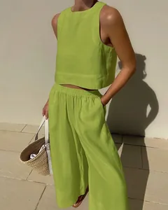 Detailed view of women's lime green sleeveless tank top and wide-leg pants linen set
