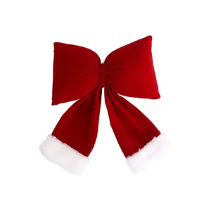 Large red velvet Christmas bow with white faux fur trim for holiday tree decoration