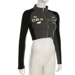 Detail view of a street style cropped moto zip-up top with letter print