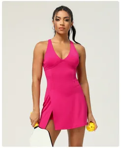 Front view of hot pink quick-dry athletic dress with built-in romper and chest pads.
