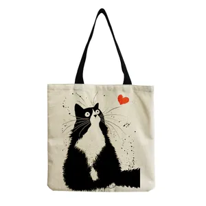 Detailed view of reusable cotton linen tote bag with cute fluffy black cat and red heart.