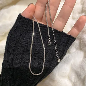 Detailed macro view of a sparkling sterling silver galaxy clavicle chain necklace for women
