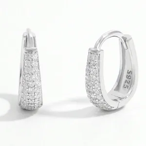 Detail view of silver S925 hoop earrings with shimmering pavé cubic zirconia stones