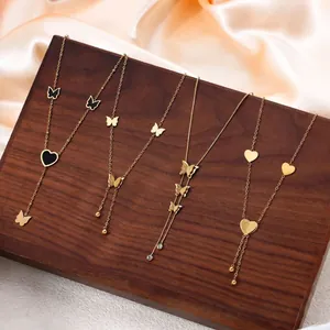 Set of 18k gold plated titanium steel necklaces with butterfly and heart charms.