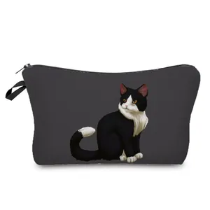 Detailed close-up of a cute tuxedo cat illustration on a grey cosmetic bag