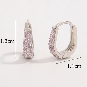 Detailed view of pavé pink zircon gold-plated hoop earrings with dimensions 1.3cm x 1.1cm