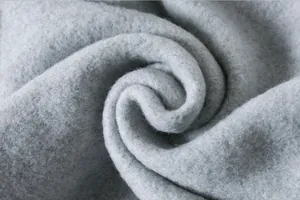 Macro detail of premium soft grey fleece fabric used in children's winter sweatshirts