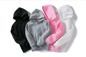 Detail view showing a variety of solid color children pullovers in black, grey, pink and white