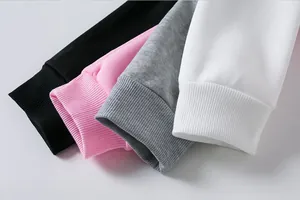 Close-up macro detail showing the ribbed texture of sweatshirt cuffs in four solid colors