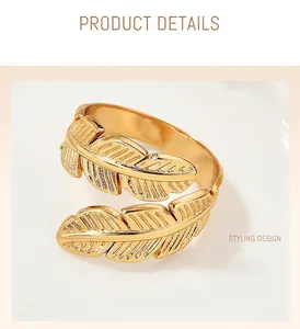 Close-up detail of a vintage golden leaf-shaped ring with textured engraving