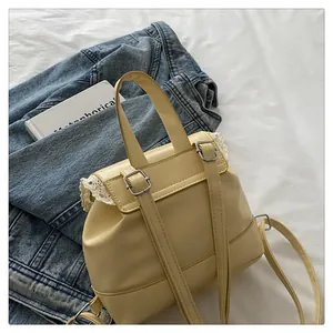 Stylish cream yellow faux leather backpack with delicate lace trim detail for women