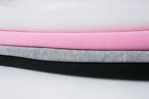 Macro detail of soft knit sweatshirt fabric in white pink gray and black