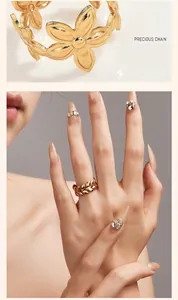 Detail shot of vintage golden leaf ring and flower jewelry on an Asian model's hand