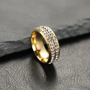 Luxurious gold stainless steel band ring featuring double rows of inlaid white crystals