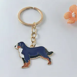 Detailed view of a cute Bernese Mountain Dog enamel keychain with premium gold finish