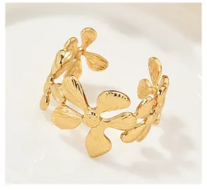Elegant vintage gold floral adjustable ring featuring detailed textured flower petals