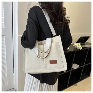 Large white corduroy tote bag for women showing stylish texture and shoulder strap