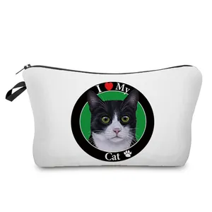 Detail view of a white canvas makeup bag with a cute black and white cat print.