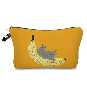Close-up of cute cat and banana illustration printed on a yellow makeup bag organizer