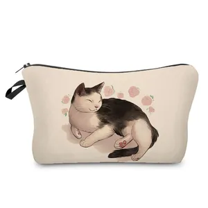 Detailed macro view of the cute sleeping cat and pink roses print on a beige pouch.