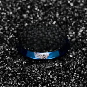 Elegant 4mm blue faceted tungsten carbide ring for men and women on black background