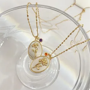 Vintage gold birth flower oval pendant necklace with crystals in 80-100 characters.