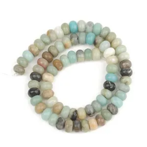 Detail shot of natural stone abacus spacer beads in mixed earthy tones for DIY jewelry