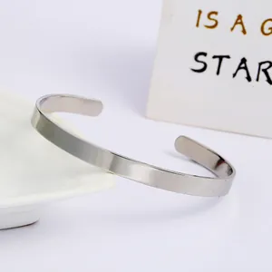 Minimalist stainless steel open cuff bracelet featuring an adjustable C-shape design