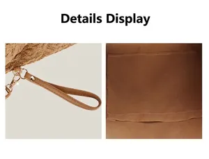Close-up of woven straw handbag details showing the wrist strap and internal patch pocket