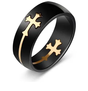 Detailed view of masculine black titanium steel ring with golden cross inlay design