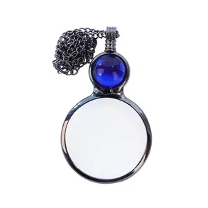 Vintage black magnifying glass necklace with an elegant blue gemstone accent detail