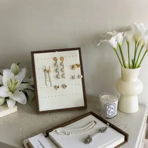 Minimalist black walnut wood jewelry display stand with white earring organizer board