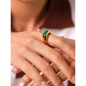 Elegant French vintage gold stainless steel signet ring featuring a green enamel inlay