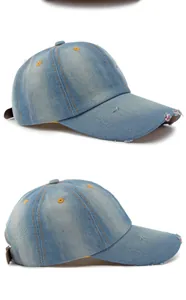 Detail view of washed denim baseball cap with distressed brim and vintage style