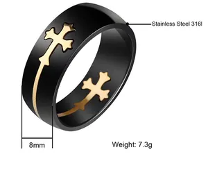Detailed view of men's black stainless steel ring with gold cross motif and 8mm width