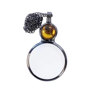 Vintage functional magnifying glass necklace with decorative amber bead pendant accessory