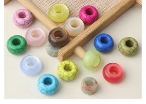 Detailed view of colorful resin large hole beads with various crackle and marble textures