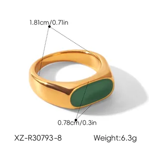 Detail view of green enamel stainless steel ring with dimensions 1.81cm and 0.78cm.