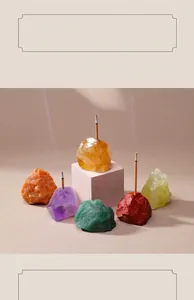 Close-up of colorful natural crystal raw stone incense stick holders with smoke
