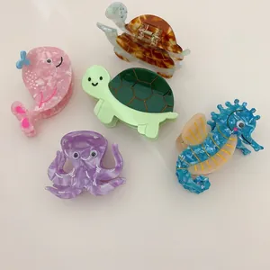Detail view of acetate hair claws in cute turtle, whale, and seahorse shapes