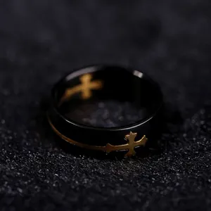 Men's black titanium steel ring featuring a detachable gold cross decorative element