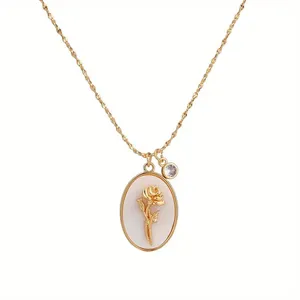 Detailed close-up of a vintage golden rose oval necklace with purple gemstone charm