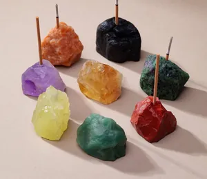 Arrangement of various colorful natural raw crystal stone incense holders with 3mm pre-drilled holes